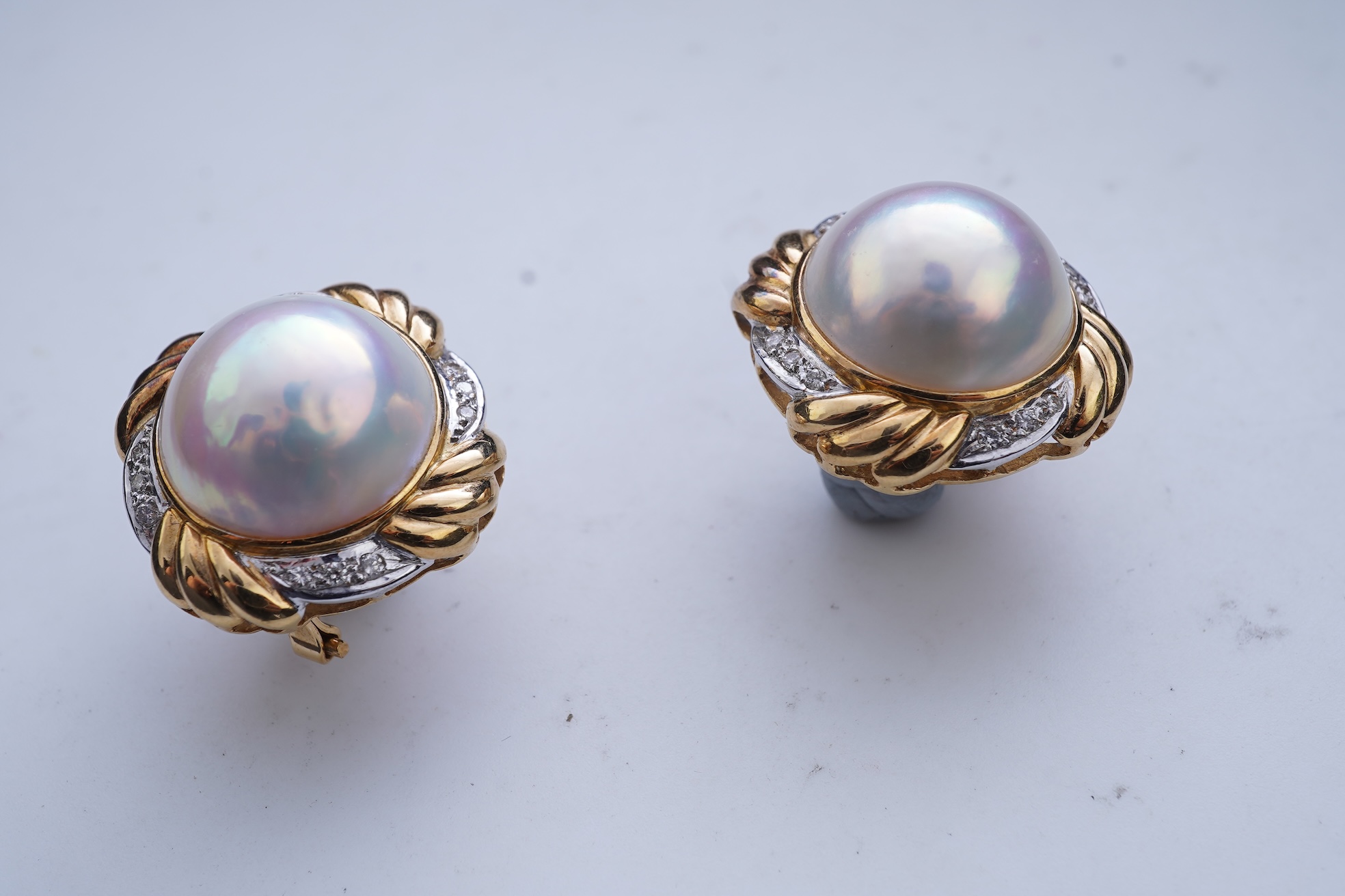 A pair of mabé cultured pearl and diamond earrings